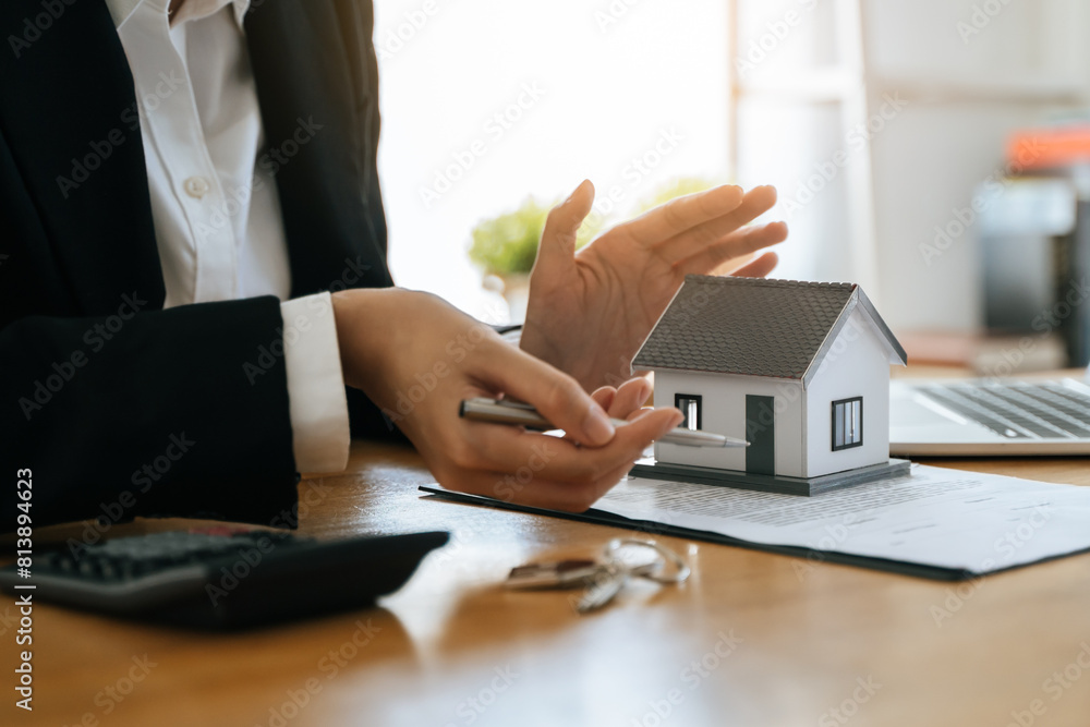 Fototapeta premium Hand of landlord, realtor pointing sign signature contract rental, purchase, buyer home or apartment with tenant, client after banker agreement mortgage, loan success or done. Property agent concept.