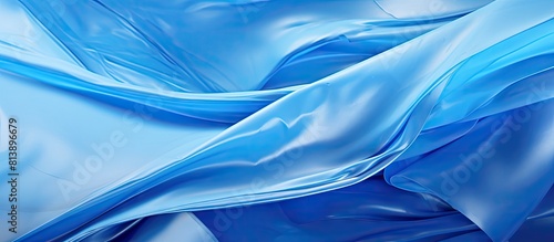 An abstract background with a blue plastic foil providing copy space for images photo