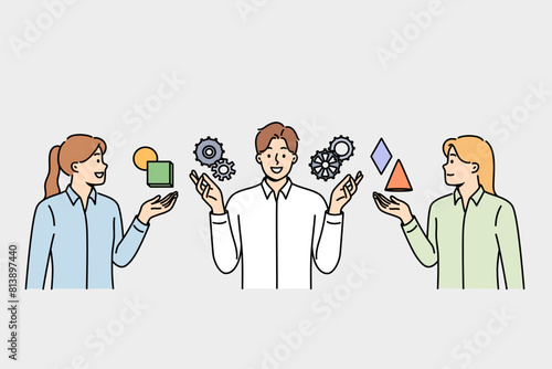 Team of people are discussing business management and consulting with specialist, standing near gears. Successful male manager explains to girls rules of management in industrial sector