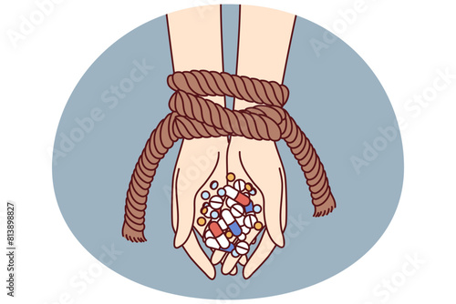 Hands of connected person with antibiotics and psychotropic drugs as metaphor for addiction to pills with narcotic effect. Uncontrolled use of antidepressants and amphetamine pills is addictive © drawlab19