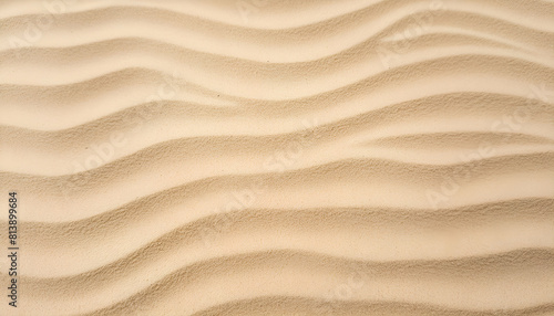 Sand pattern of a beach in the summer with wavy surface and details. © O