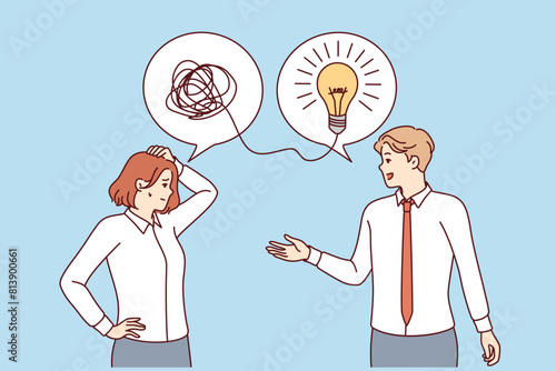 Man mentor brainstorms for woman colleague with confused thoughts, standing under light bulb symbolizing idea. Mentor supports newcomer to company, giving advice on overcoming difficulties