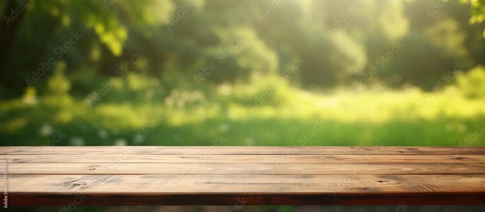 A wooden table with no items on it set against a blurred green background providing ample space for adding images or text