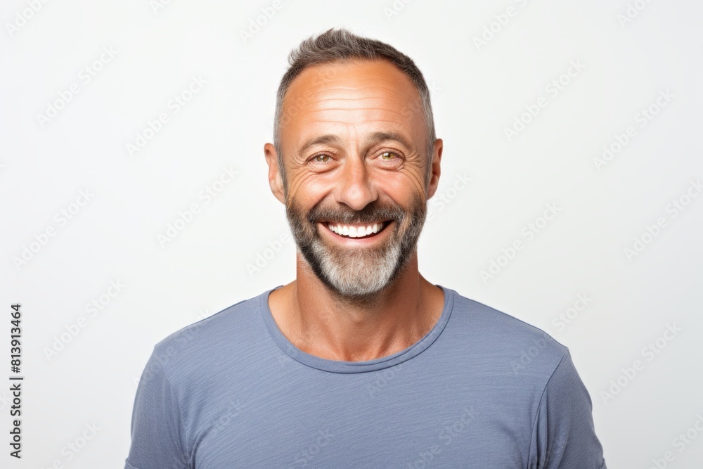 Portrait of a joyful man in his 40s smiling at the camera isolated on white background Portrait of a joyful man in his 40s smiling at the camera isolated on white background