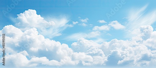 Fototapeta Naklejka Na Ścianę i Meble -  A stunning copy space image of pastel blue skies with isolated beautiful clouds
