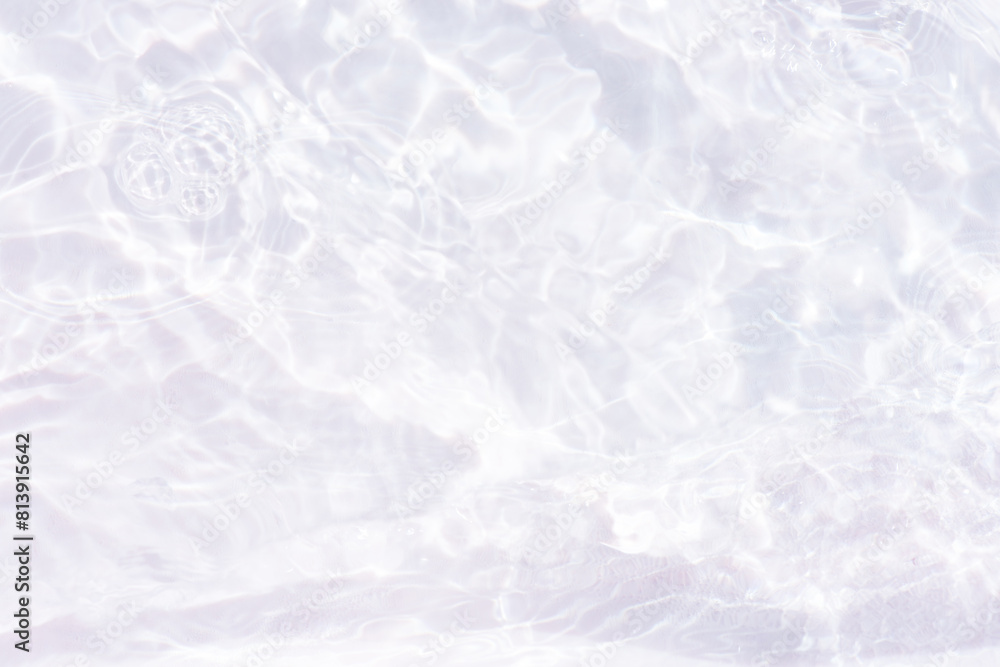 White water with ripples on the surface. Defocus blurred transparent white colored clear calm water surface texture with splashes and bubbles. Water waves with shining pattern texture background. White water with ripples on the surface. Defocus blurred transparent white colored clear calm water surface texture with splashes and bubbles. Water waves with shining pattern texture background.