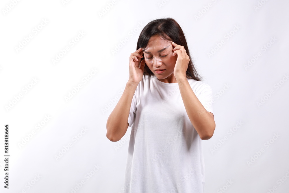 Frustrated asian woman, touching her head, pointing at forehead, standing with eyes closed and concerned face, suffers headache, thinking, trying to remember. Isolated on white background. Frustrated asian woman, touching her head, pointing at forehead, standing with eyes closed and concerned face, suffers headache, thinking, trying to remember. Isolated on white background.