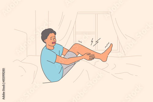 Severe pain or spasm in leg woke up man, making suffering grimace as rose from bed