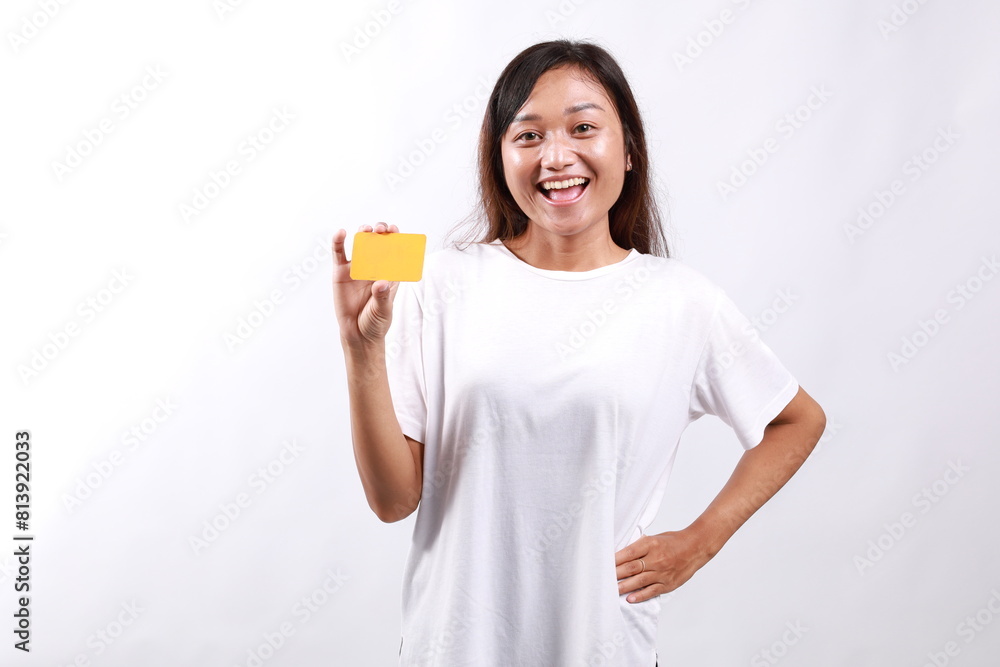 Happy Young asian woman in casual clothes showing blank card, approve and recommend, smiling at camera, white background Happy Young asian woman in casual clothes showing blank card, approve and recommend, smiling at camera, white background