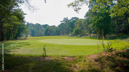 View of Golf Course with beautiful putting green. Golf course with a rich green turf beautiful scenery.