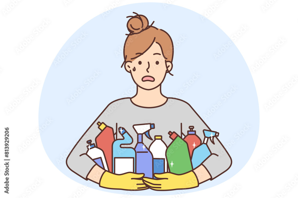 Stressed woman with detergent bottles Stressed woman with detergent bottles