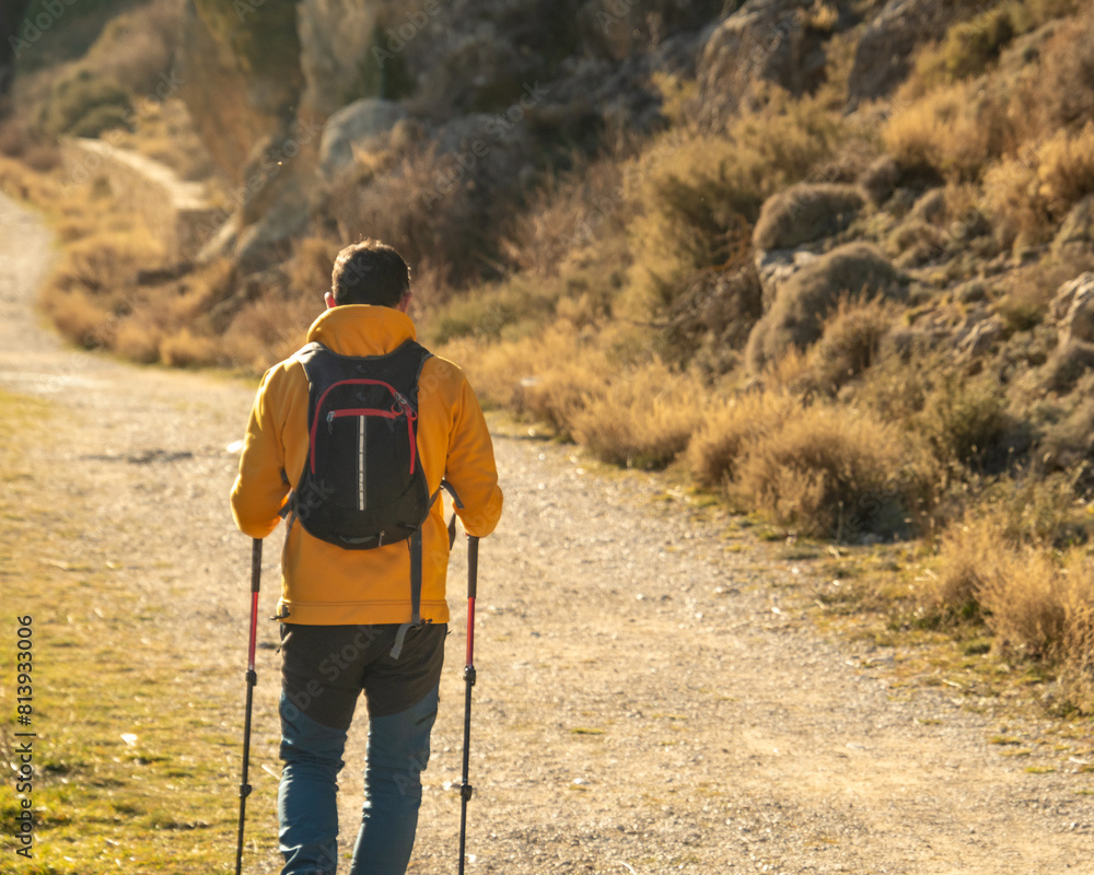 Hiker walking along a path Hiker walking along a path