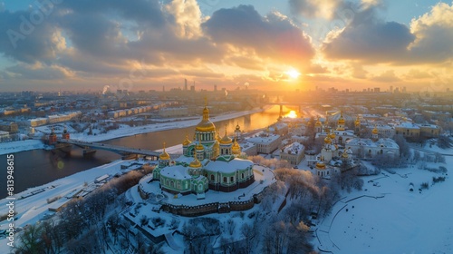 Golden domes gleam at sunset over snowy cityscape photo
