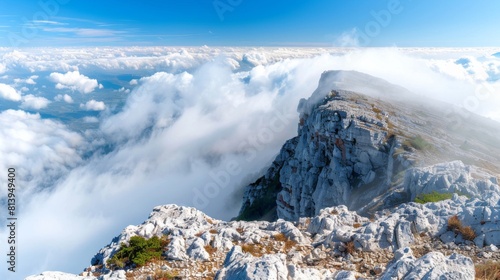 Breathtaking panoramic view from Corno Grande Peak in Gran Sasso with a cloud inversion below. photo