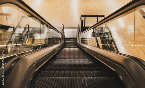 Escaleras mecánicas en la estación de metro de Chamartin en Madrid, España. Vista de la escaleras mecánica y sus escalones desde lo alto. photo