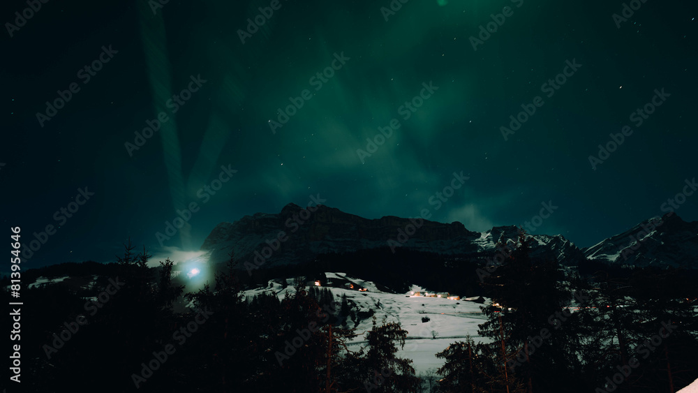 Aurora Brilliance: Snowy Peaks Bathed in Northern Lights Aurora Brilliance: Snowy Peaks Bathed in Northern Lights