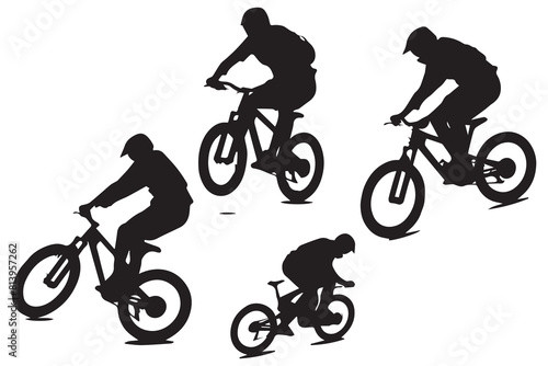 Silhouette of a cyclist jumping on a bicycle