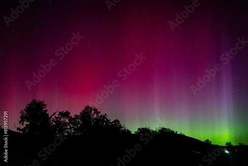 The Aurora Borealis or Northern Lights dance in the skies of Natural Bridge, Virginia © brunovalenzano
