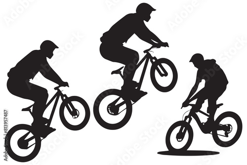 Silhouette of a cyclist jumping on a bicycle