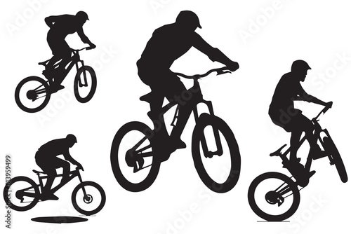 Silhouette of a cyclist jumping on a bicycle