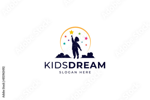 vector design logo of a silhouette of a boy reaching for a colorful star on a moon and clouds background