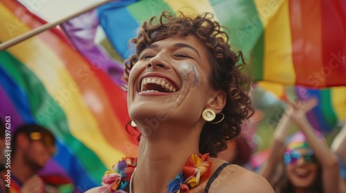A candid moment capturing the essence of LGBTQ+ celebration, where joyous laughter and vibrant flags fill the frame