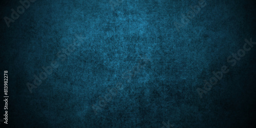 Dark blue stone wall blank backdrop light design. Dark blue or black slate background rock distress texture. High Resolution on dark black and blue Cement Texture Background.