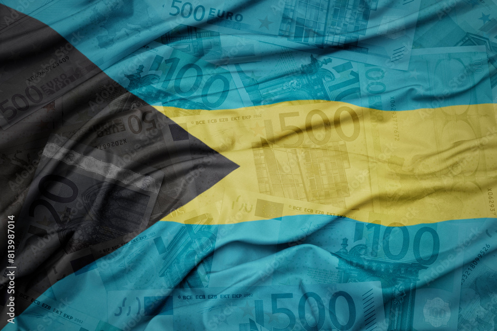 waving colorful national flag of bahamas on a euro money banknotes background. finance concept.