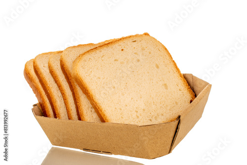 Three slices of white toaster bread on a paper plate, macro, isolated on a white background.
