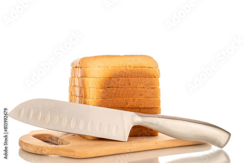 Several slices of white bread for a toaster with a knife on a wooden kitchen board, macro, isolated on a white background.