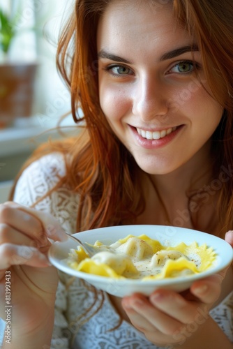 Woman holding a plate of food, suitable for food and nutrition concepts