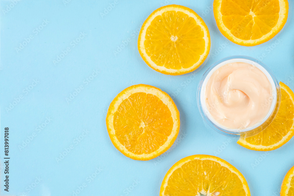 Orange citrus Vitamin C face care - cream, serum. mask, face cleaner, antioxidant moisturizer skin face care and make up concept, with fresh orange fruit slices Orange citrus Vitamin C face care - cream, serum. mask, face cleaner, antioxidant moisturizer skin face care and make up concept, with fresh orange fruit slices