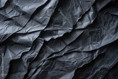 Close up of a piece of black paper, suitable for various design projects