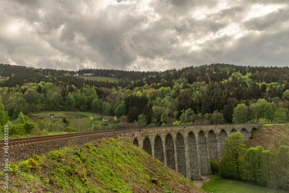 Stone viaduct near in spring cloudy evening near Novina village Stone viaduct near in spring cloudy evening near Novina village