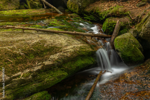 Jeleni waterfall in spring sunny cloudy day in Jizerske mountains photo