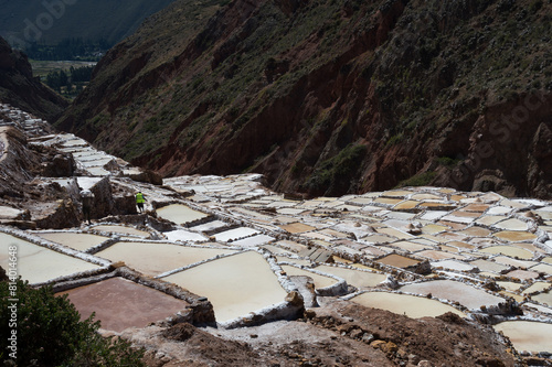 Terraces of different sizes for retention and evaporation of salt water for salt extraction in Maras in Peru photo