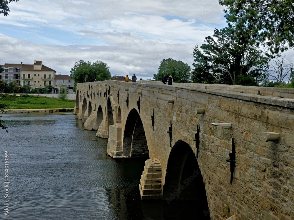 Naklejka premium Béziers, May 2024: Visit the magnificent city of Béziers in Occitanie. Street photos - View of Saint-Nazaire and Saint-Celsus cathedrals With the Pont Vieux