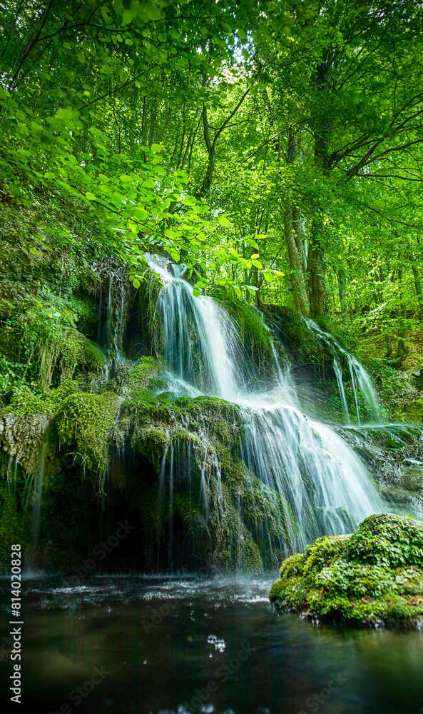 Beautiful spring waterfall Dokuzak in Strandzha Mountain, Bulgaria . Strandja mountain, waterfall in the forest. Magnificent landscape near Burgas Beautiful spring waterfall Dokuzak in Strandzha Mountain, Bulgaria . Strandja mountain, waterfall in the forest. Magnificent landscape near Burgas