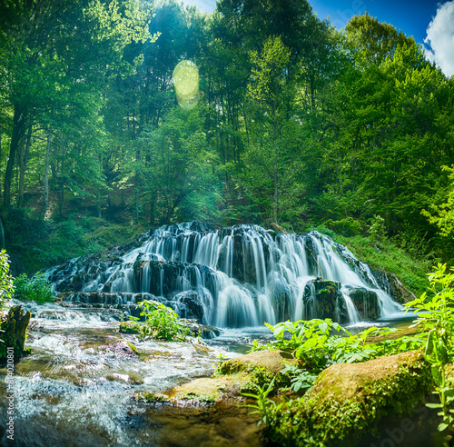 Beautiful spring waterfall Dokuzak in Strandzha Mountain, Bulgaria . Strandja mountain, waterfall in the forest. Magnificent landscape near Burgas photo