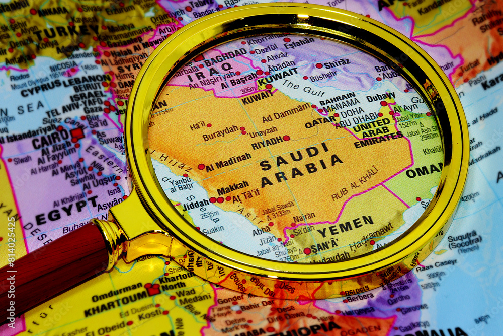 Map Saudi Arabia under magnifying glass, loupe. Kingdom of Saudi Arabia on the World Map Map Saudi Arabia under magnifying glass, loupe. Kingdom of Saudi Arabia on the World Map