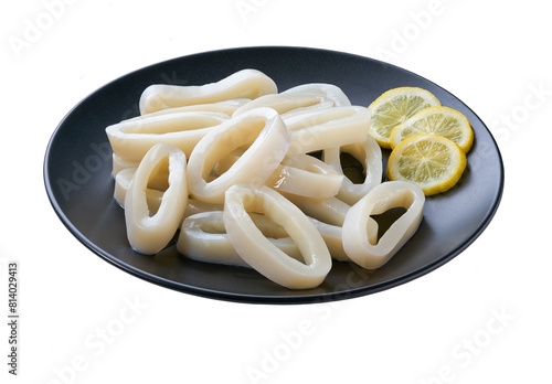 Canvastavla Fresh squid rings in a black plate  isolated on a white background