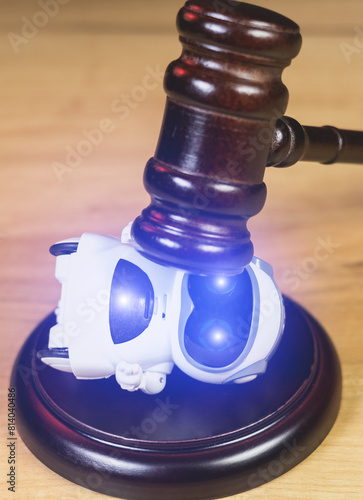 Judge Hammer for adjudication to the Real Robot. Adjudgement Gavel with wooden stand. Lawyer decision about Digital  assistant. Pronouncing sentence to the AI Artificial Intelligence.