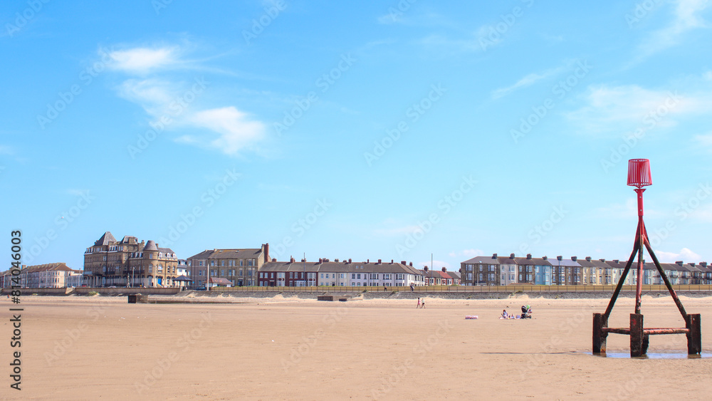 The North East sea side town of Redcar, North Yorkshire showing the beach and the promenade.