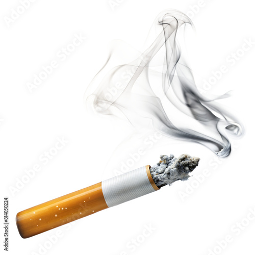 A cigarette burns at the end, trailing smoke upwards photo