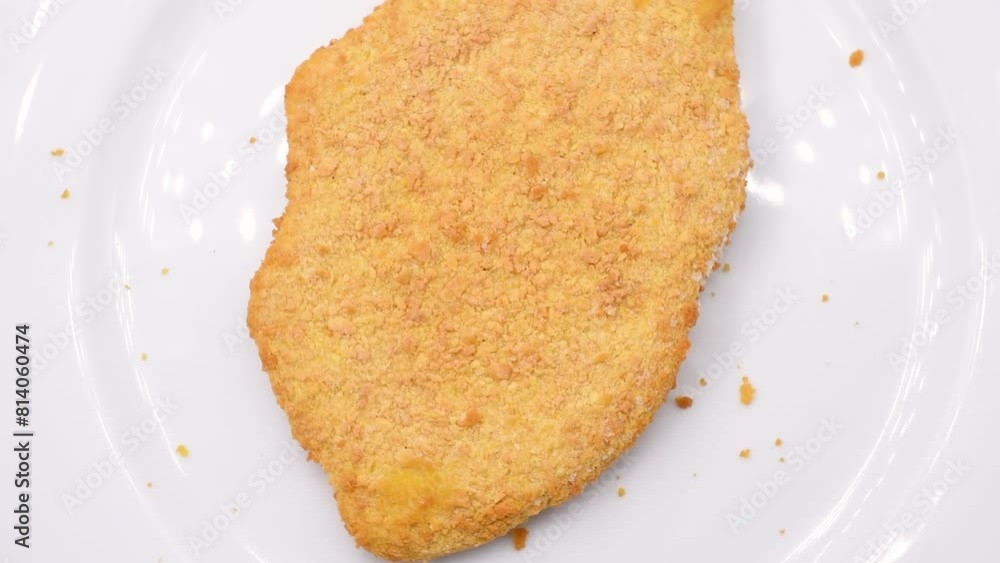 frozen chicken cutlet,cotoletta di pollo surgelata,close-up,rotating video frozen chicken cutlet,cotoletta di pollo surgelata,close-up,rotating video