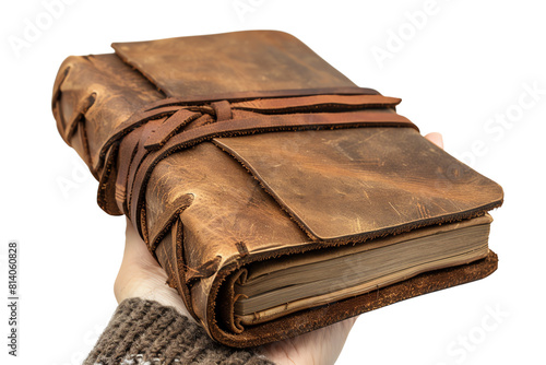 An old leather-bound book with a strap. photo