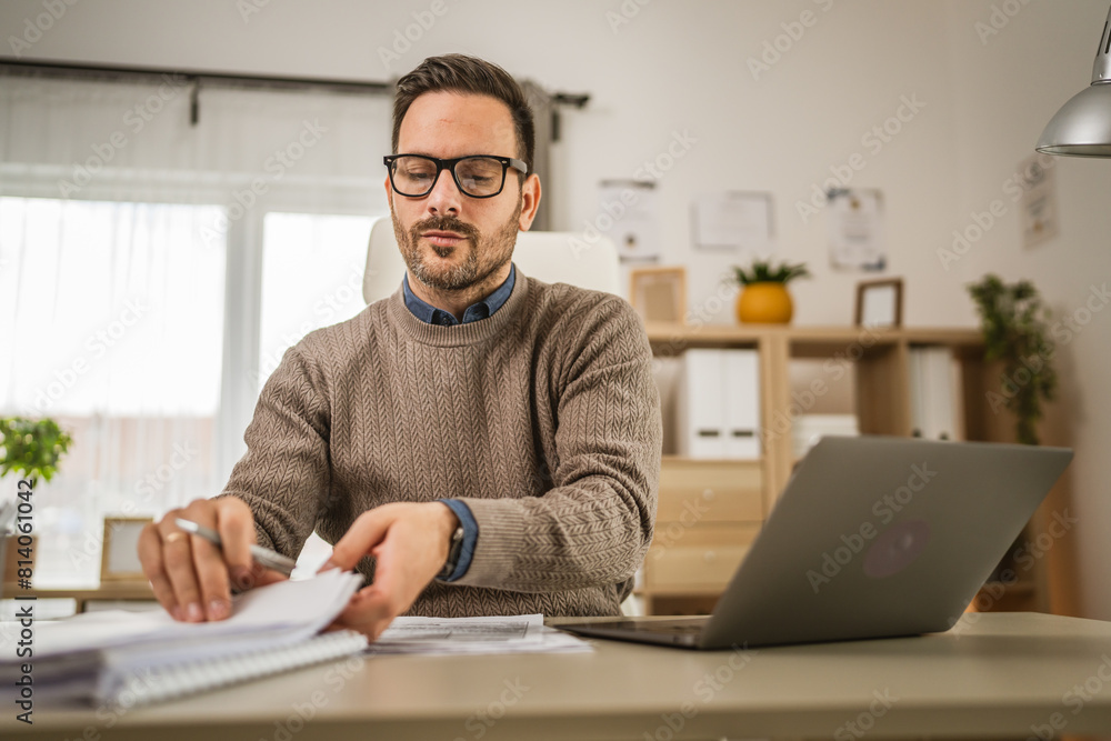 Adult businessman sit at office hold and read, think about document Adult businessman sit at office hold and read, think about document