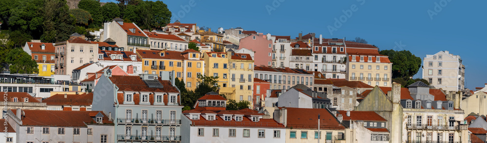 Panoramic view of skyline of Lisbon city, Portugal, many colorful houses in the Alfama district during a sunny day.