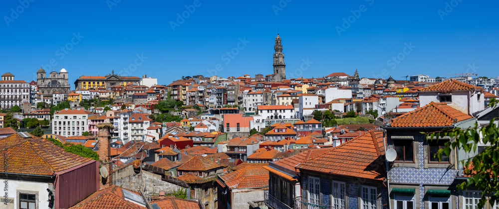 Panoramic view of UNESCO world heritage site Porto city in Portugal during sunny day with blue sky.
