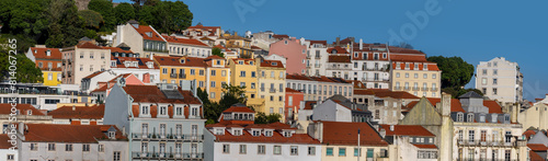 Panoramic view of skyline of Lisbon city, Portugal, many colorful houses in the Alfama district during a sunny day.